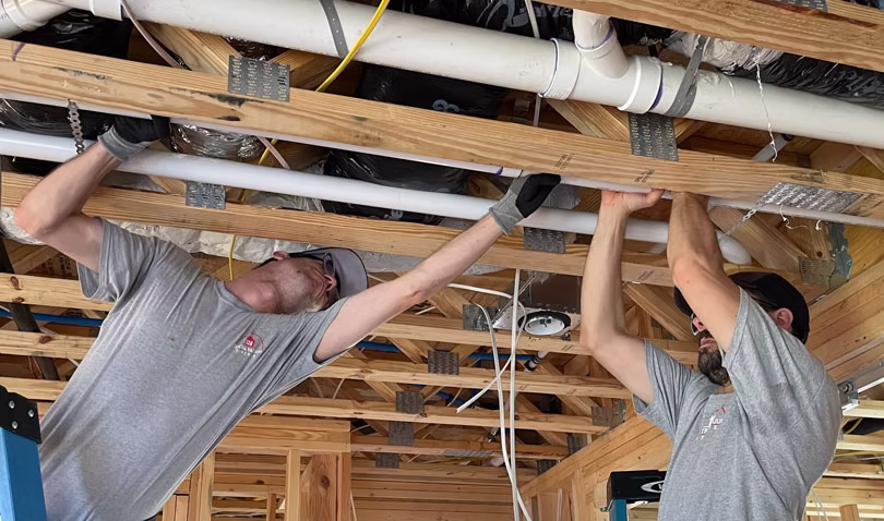 Home under construction with framed walls